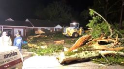 Crews worked to remove a huge tree that came down right next to a house on Madison St. in Calhoun City.