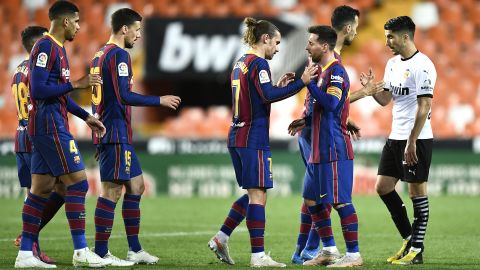 Barcelona players celebrate after the final whistle. 