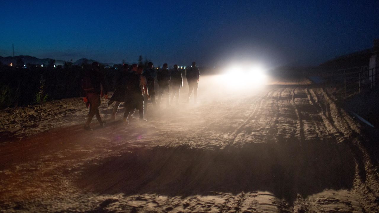 Central American asylum seekers are detained by the the US Border Patrol after they crossed into the  United States from Mexico on April 29, 2021, near Yuma, Arizona. 