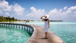 underscored woman in maldives overwater bungalows