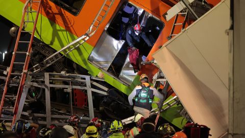 Emergency personnel search for accident survivors after a raised subway track collapsed on May 3 in Mexico City.