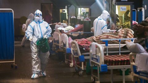 Health workers attend to patients inside a banquet hall temporarily converted into a Covid-19 ward in New Delhi, India, on May 1.