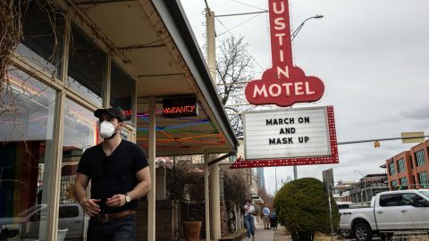 The Austin Motel displays a message on its marquee encouraging people to wear masks.