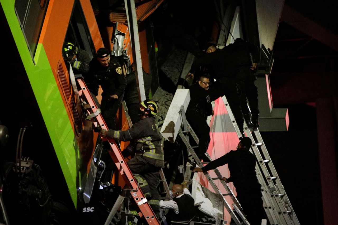 Rescuers work at the scene of the collapse.