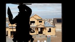A contractor frames a house under construction in Lehi, Utah, U.S., on Wednesday, Dec. 16, 2020. 