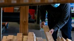 A customer wearing a protective mask views lumber for sale at a Home Depot Inc. store in Daly City, California, U.S., on Monday, Nov. 16, 2020. Home Depot Inc. is scheduled to release earnings figures on November 17. Photographer: Josie Norris/Bloomberg via Getty Images
