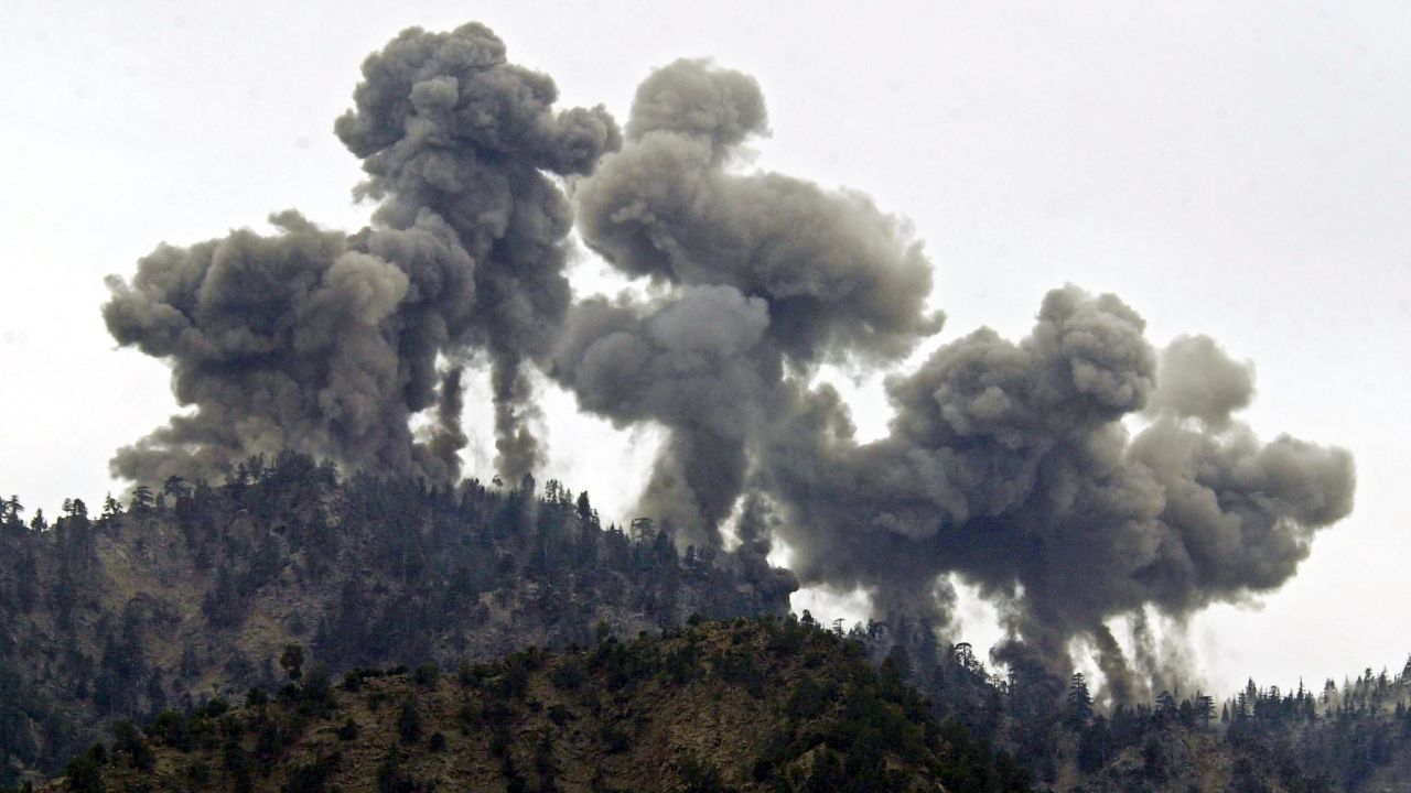Explosions rock al Qaeda positions in the Tora Bora region of Afghanistan after an attack by US warplanes on December 14, 2001.