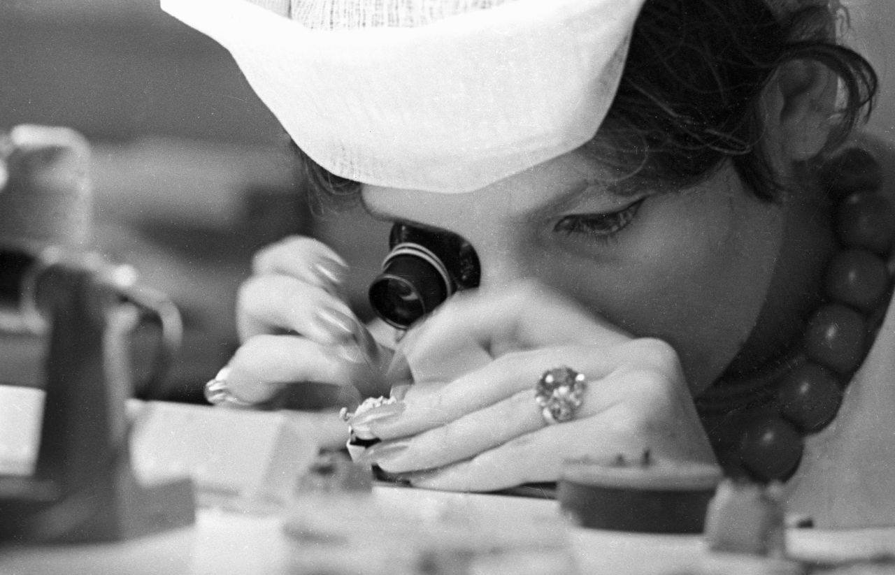 A worker at the Second Moscow Clock factory assembles a watch.