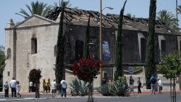A fire that gutted much of the historic Catholic church in Southern California last year was intentionally set by a 57-year-old man, prosecutors said Tuesday, May 4, 2021. John David Corey faces multiple felony counts including arson of an inhabited structure, the Los Angeles County District Attorney's Office said in a statement. (AP Photo/Marcio Jose Sanchez, File)