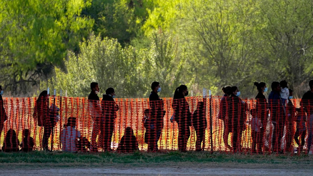 Migrants are seen in custody at a U.S. Customs and Border Protection processing area under the Anzalduas International Bridge, Friday, March 19, 2021, in Mission, Texas. (AP Photo/Julio Cortez)