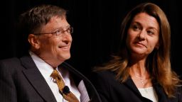 Bill Gates, left, smiles with his wife Melinda Gates, during a ceremony honoring the couple with the 2010 J. William Fulbright Prize for International Understanding at the Library of Congress in Washington, on Friday, Oct. 15, 2010. (AP Photo/Jacquelyn Martin)