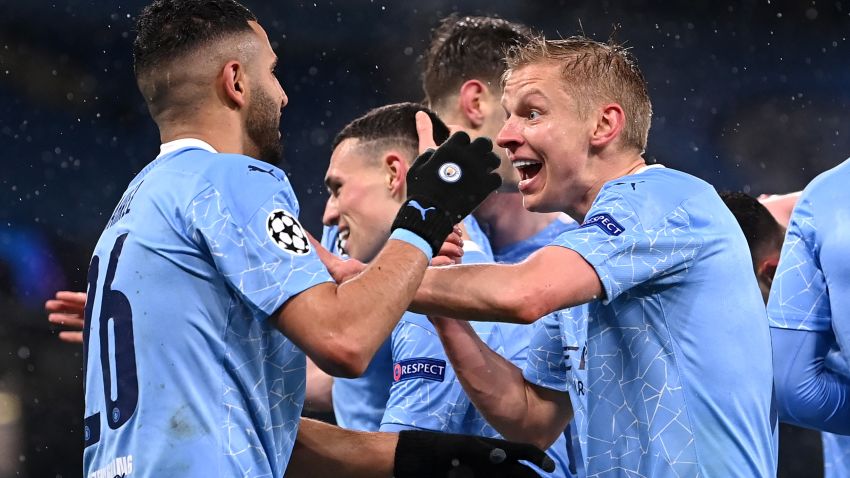 MANCHESTER, ENGLAND - MAY 04: Riyad Mahrez of Manchester City celebrates with Oleksandr Zinchenko after scoring his team's second goal during the UEFA Champions League Semi Final Second Leg match between Manchester City and Paris Saint-Germain at Etihad Stadium on May 04, 2021 in Manchester, England. Sporting stadiums around the UK remain under strict restrictions due to the Coronavirus Pandemic as Government social distancing laws prohibit fans inside venues resulting in games being played behind closed doors. (Photo by Laurence Griffiths/Getty Images)