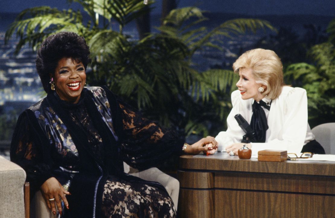Joan Rivers was often a guest host for Carson on "The Tonight Show," as pictured here with Oprah Winfrey, but wound up competing against him with her own short-lived Fox show.