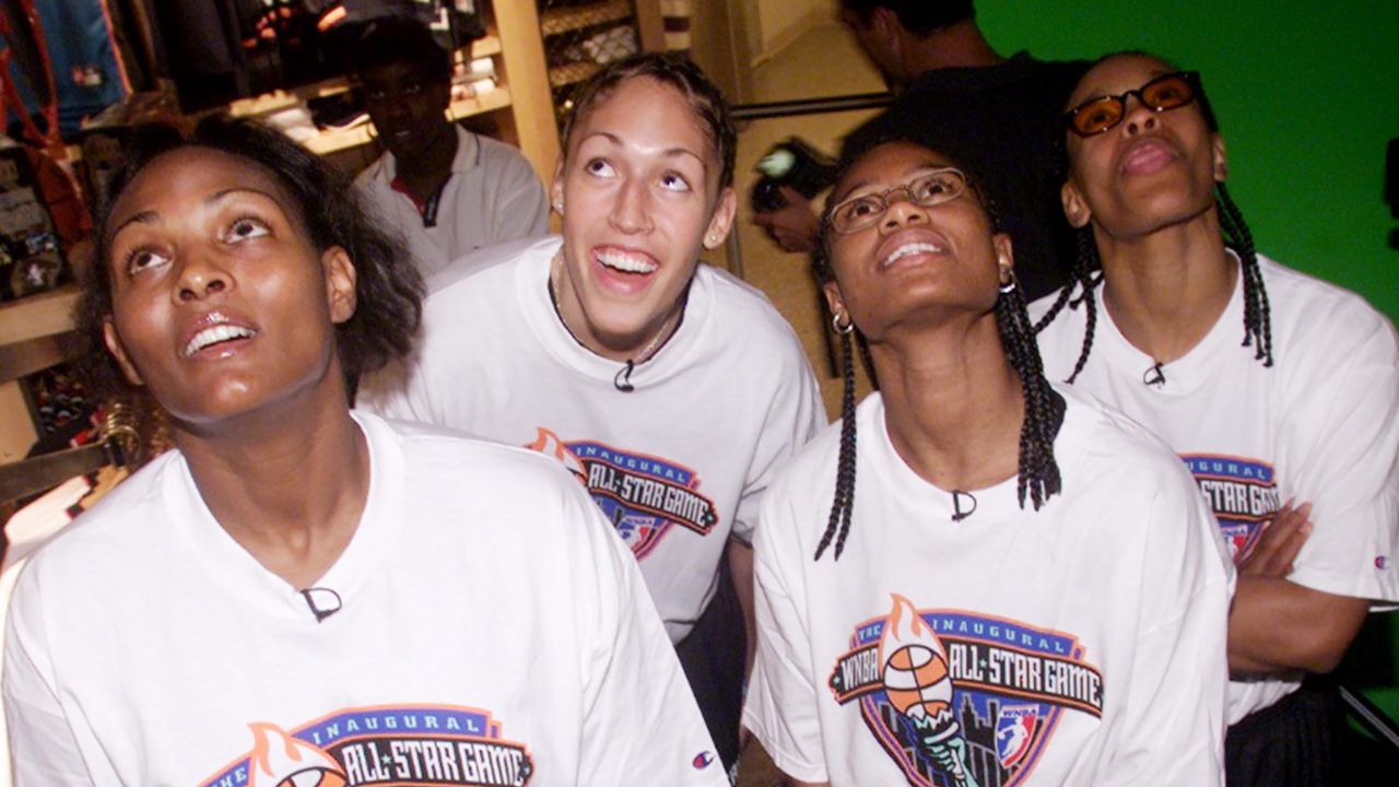 WNBA All-Stars (l. to r.) Kym Hampton; Rebecca Lobo; Vickie Johnson and Theresa Weatherspoon, of the New York Liberty, look at video at the NBA Store on Fifth Ave., where they met fans.  
