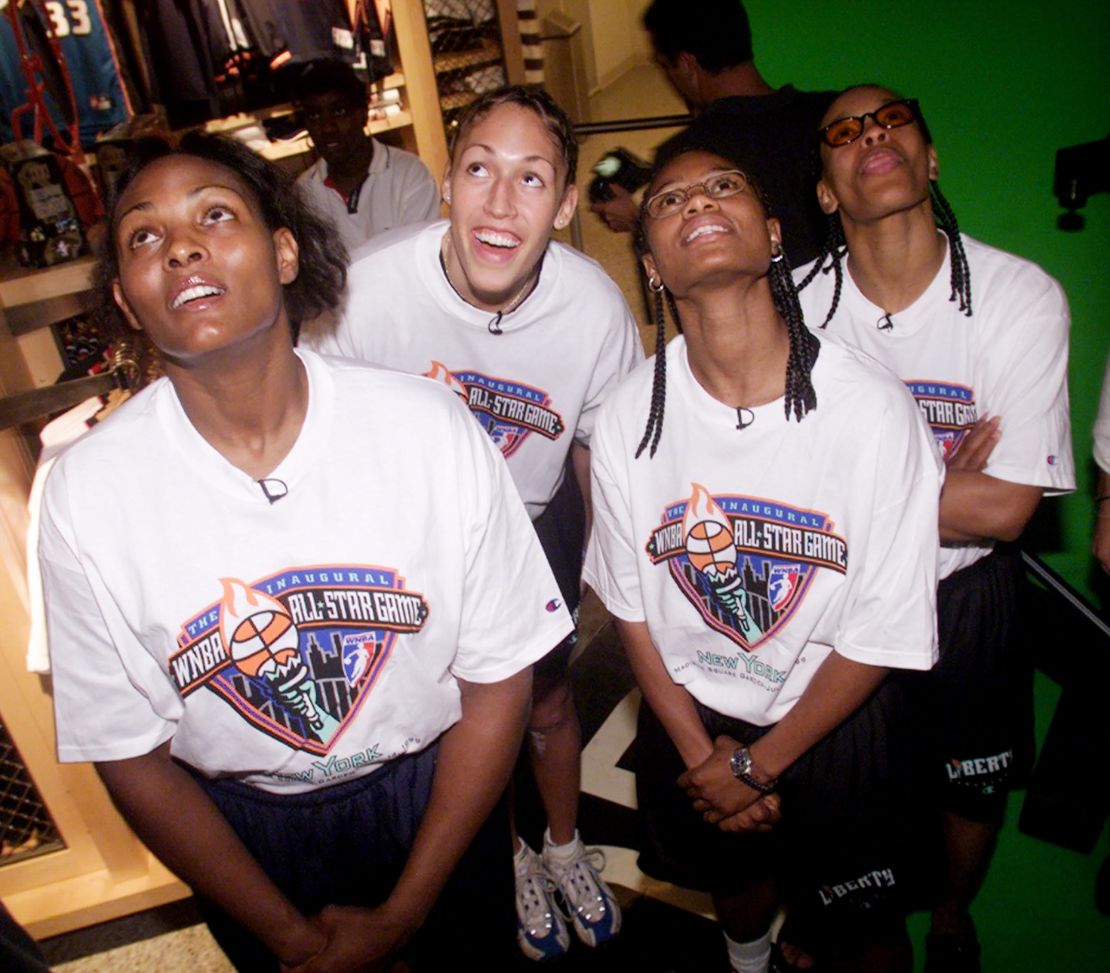 WNBA All-Stars (left to right) Kym Hampton;  Rebecca Lobo;  The New York Liberty's Vickie Johnson and Theresa Weatherspoon watch a video at the NBA Store on Fifth Avenue, where they met with fans.  