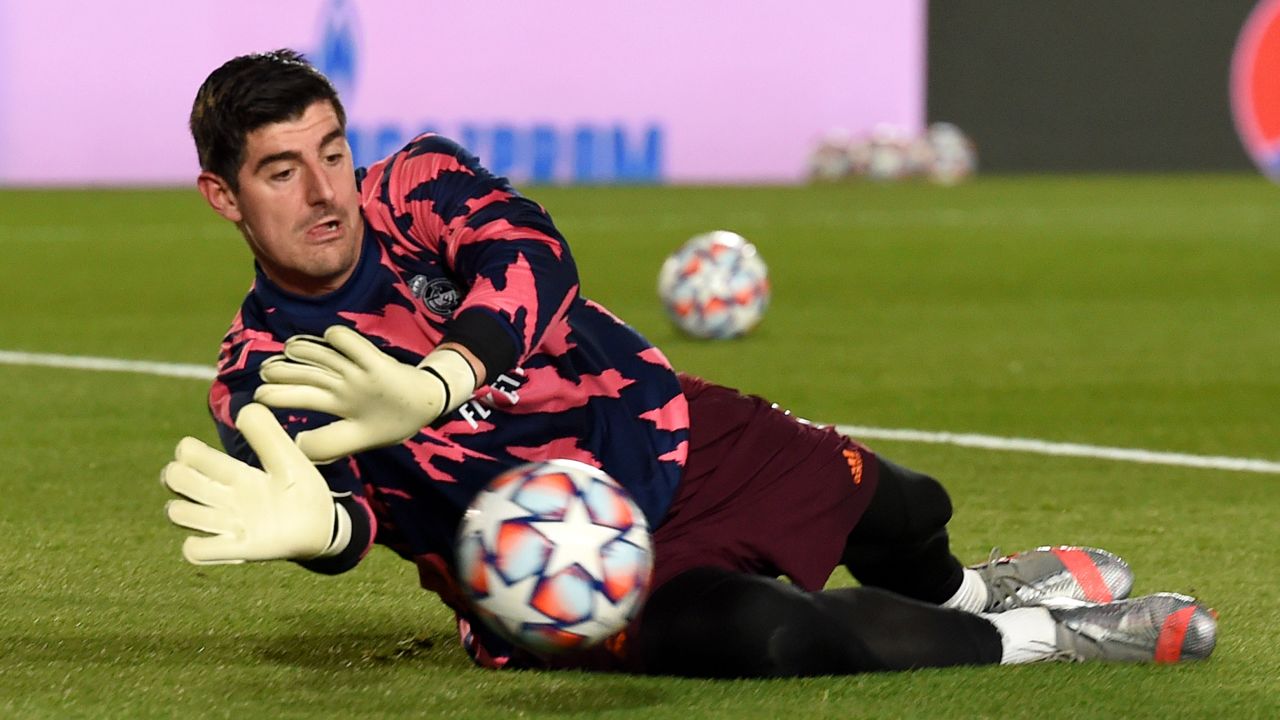 MADRID, SPAIN - DECEMBER 09: Thibaut Courtois of Real Madrid warms up prior to the UEFA Champions League Group B stage match between Real Madrid and Borussia Moenchengladbach at Estadio Alfredo di Stefano on December 09, 2020 in Madrid, Spain. Sporting stadiums around Spain remain under strict restrictions due to the Coronavirus Pandemic as Government social distancing laws prohibit fans inside venues resulting in games being played behind closed doors. (Photo by Denis Doyle/Getty Images)