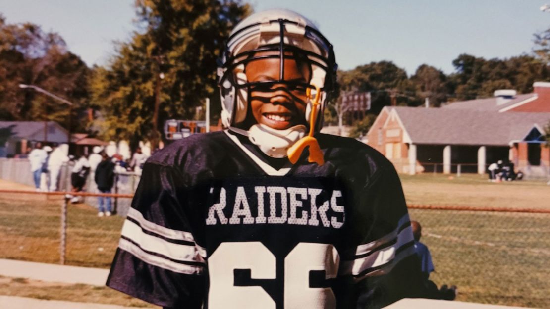 Timothy Alexander, age 7, playing little league football in Birmingham, Alabama.