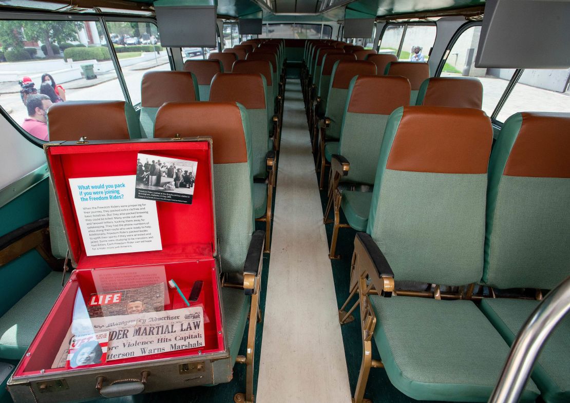 A vintage suitcase with artifacts from the Freedom Riders sits aboard the restored Greyhound bus.