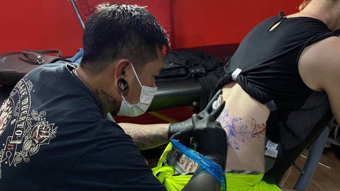 All Day Tattoo artist Bird works to coverup a bad tattoo the writer acquired while on holiday two decades ago. 