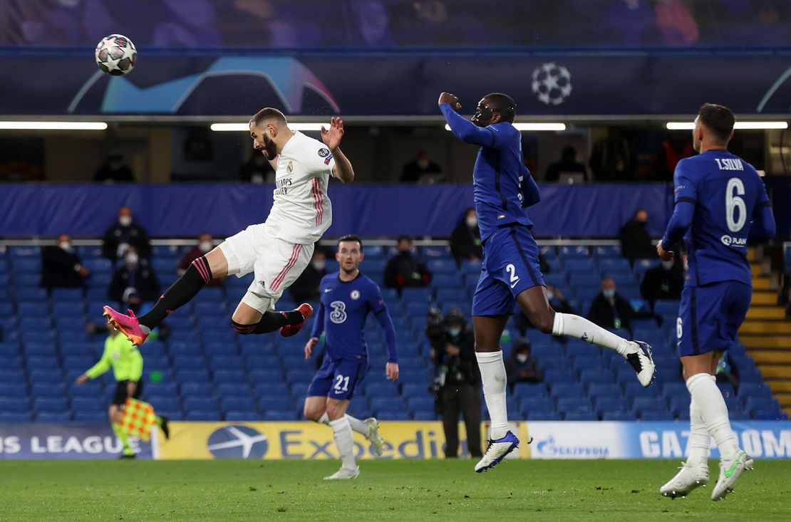 Real Madrid's Karim Benzema makes a header against Chelsea. 