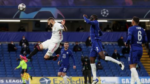 Real Madrid's Karim Benzema makes a header against Chelsea.