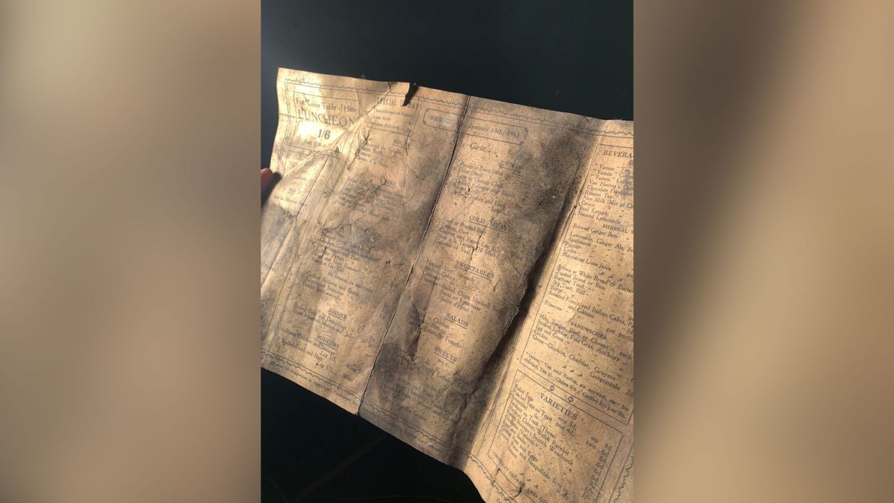 Builders renovating a Liverpool cafe found a "mind blowing" 1913 menu when it fell from the rafters, leading to the discovery of a staff hat, game of whist, and a number of bottles.