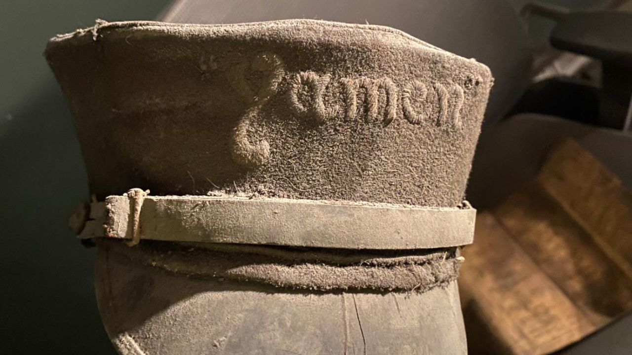 A branded hat was among a number of artifacts discovered in the rafters.