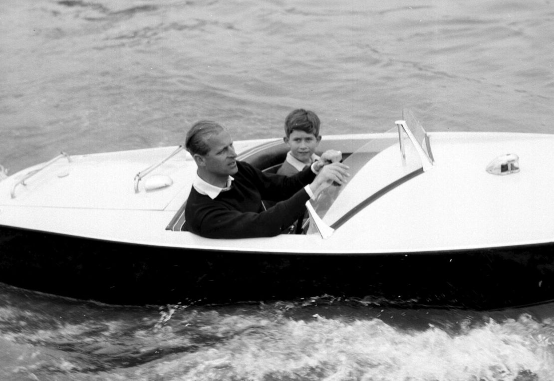 The Prince of Wales with his father, the Duke of Edinburgh during a motorboat race up the river Medina at Cowes, Isle of Wight.   (Photo by PA Images via Getty Images)