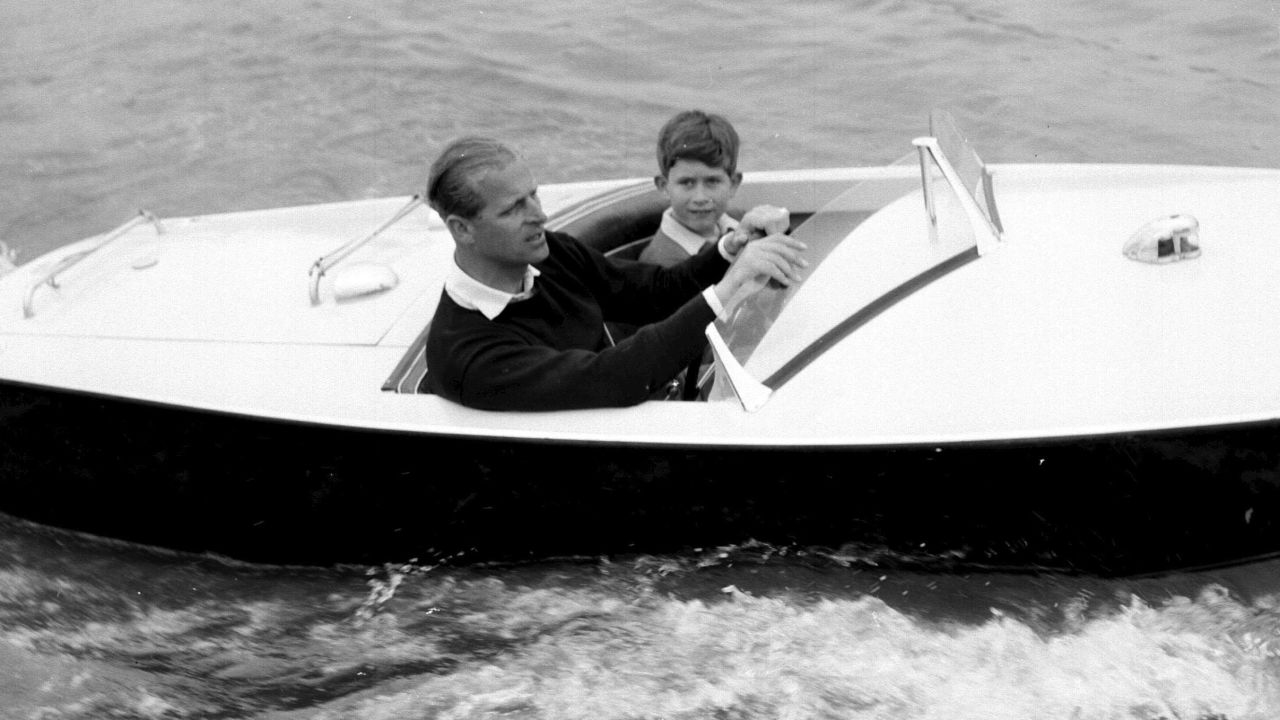 The Prince of Wales with his father, the Duke of Edinburgh during a motorboat race up the river Medina at Cowes, Isle of Wight.   (Photo by PA Images via Getty Images)