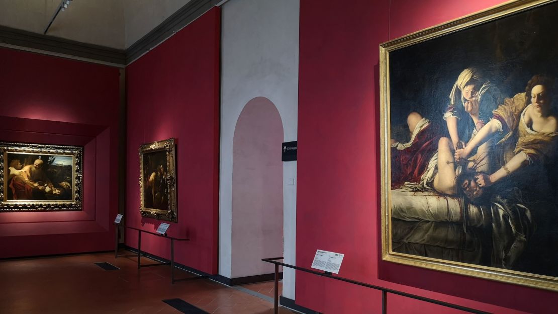 Artemisia Gentileschi's "Judith and Holofernes" shares a room with works by Caravaggio.