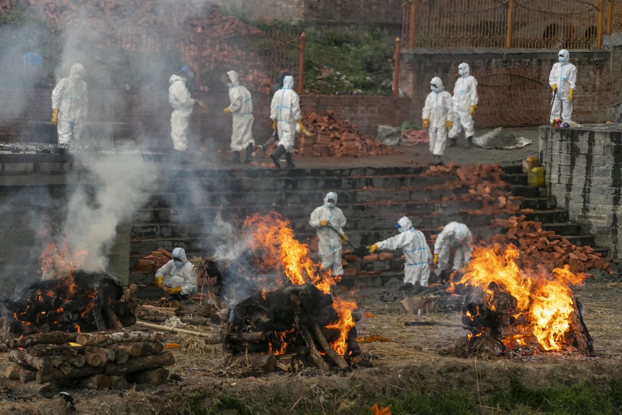 People in protective suits cremate the bodies of Covid-19 victims while others work to extend a crematorium in Kathmandu, Nepal, on May 5. <a href="index.php?page=&url=https%3A%2F%2Fedition.cnn.com%2F2021%2F05%2F06%2Fasia%2Fnepal-covid-outbreak-intl-hnk-dst%2Findex.html" target="_blank">Covid-19 cases are skyrocketing in Nepal,</a> resembling a similar outbreak in neighboring India.