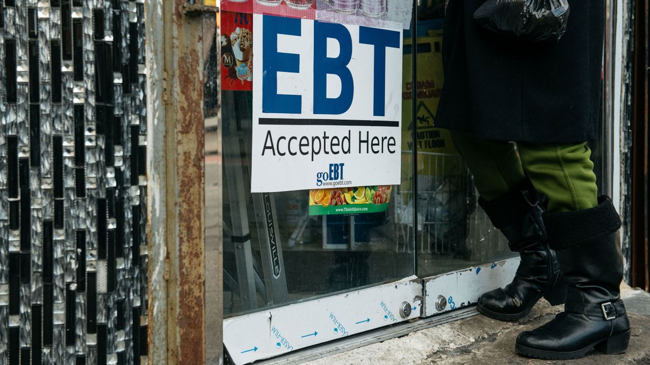 A sign alerting customers about food stamps is displayed at a Brooklyn grocery store on December 5, 2019 in New York City.