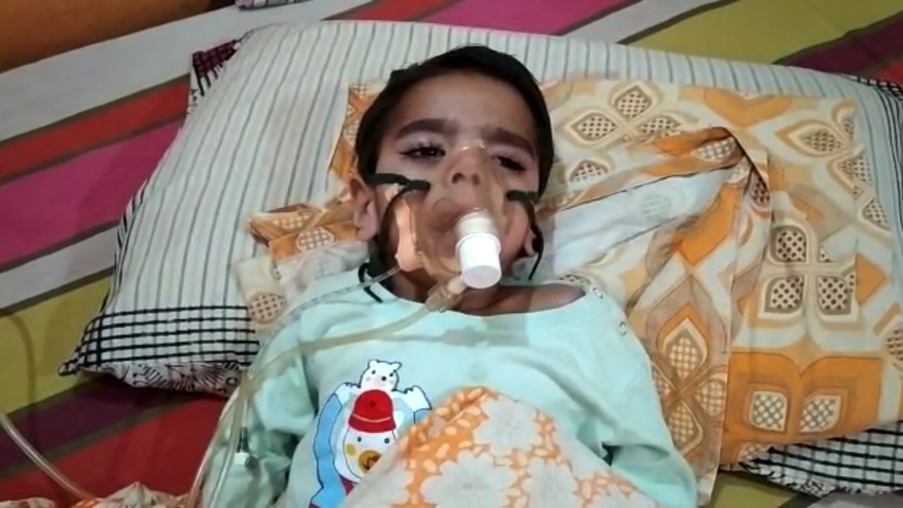 The Covid-positive three-year-old son of Alok Kumar, breathing on an oxygen cylinder in New Delhi, India, on May 5.