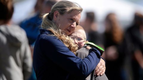 People embrace after a school shooting at Rigby Middle School in Rigby, Idaho, Thursday, May 6, 2021.