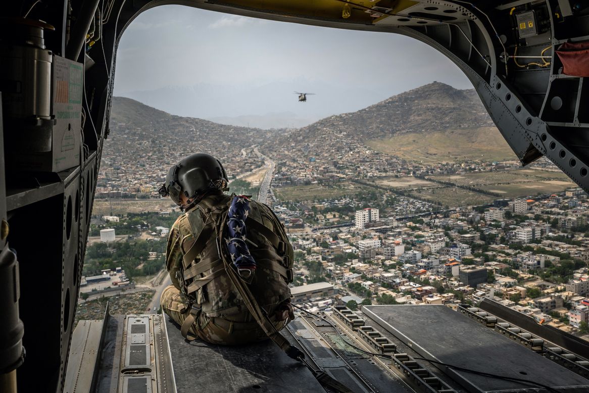 A US soldier sits aboard a Chinook helicopter over Kabul, Afghanistan, on Sunday, May 2. US President Joe Biden <a href="https://www.cnn.com/2021/04/14/politics/joe-biden-afghanistan-announcement/index.html" target="_blank">announced last month</a> that he would be withdrawing American troops from Afghanistan before September 11. <a href="https://www.cnn.com/2021/04/14/middleeast/gallery/afghanistan-war/index.html" target="_blank">Related photos: America's longest war</a>