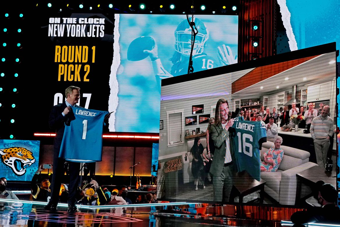 NFL Commissioner Roger Goodell looks at quarterback Trevor Lawrence after Lawrence was drafted No. 1 by the Jacksonville Jaguars on Thursday, April 29. The draft took place in front of a live audience in Cleveland, but Lawrence watched the draft with friends and family in South Carolina.