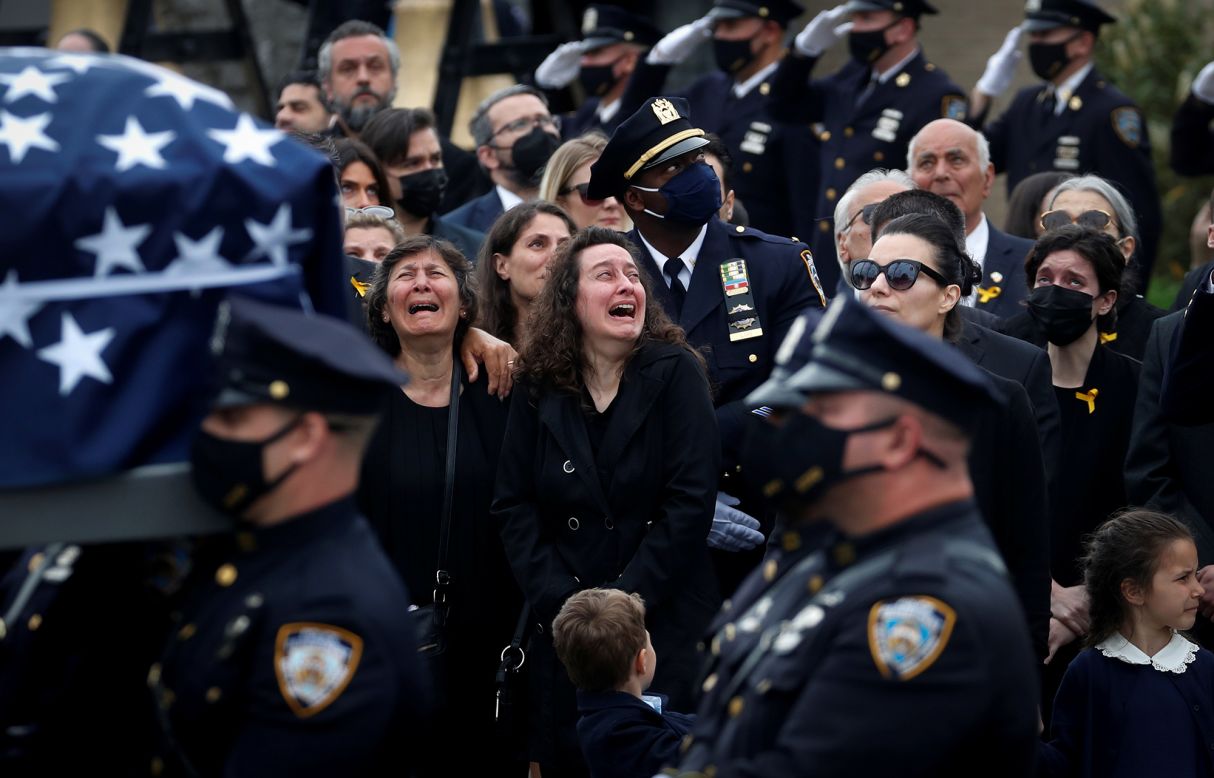 The family of New York police officer Anastasios Tsakos reacts as his casket is carried during his funeral service in Greenlawn, New York, on Tuesday, May 4. Tsakos, 43, was directing traffic on the Long Island Expressway last month when <a href="https://www.cnn.com/2021/04/27/us/nypd-officer-killed/index.html" target="_blank">he was struck by an intoxicated driver</a> early in the morning, police officials said.