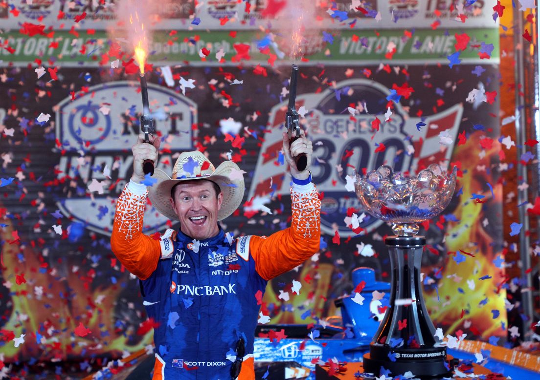 Scott Dixon fires a pair of six-shooters after winning the IndyCar race at Texas Motor Speedway on Saturday, May 1. The guns, loaded with blank rounds, <a href="https://www.star-telegram.com/sports/nascar-auto-racing/texas-motor-speedway/article208156424.html" target="_blank" target="_blank">are customary for drivers who win at the track.</a>