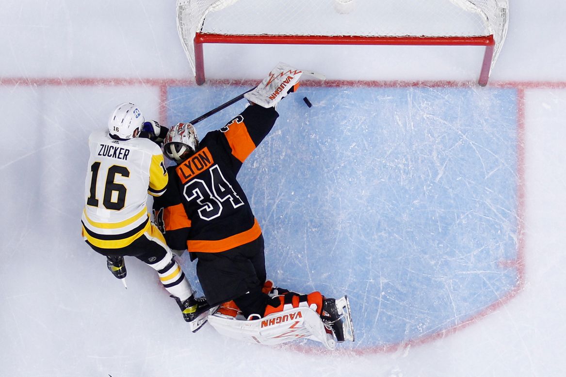 Philadelphia goaltender Alex Lyon saves a shot from Pittsburgh's Jason Zucker during an NHL game on Monday, May 3.