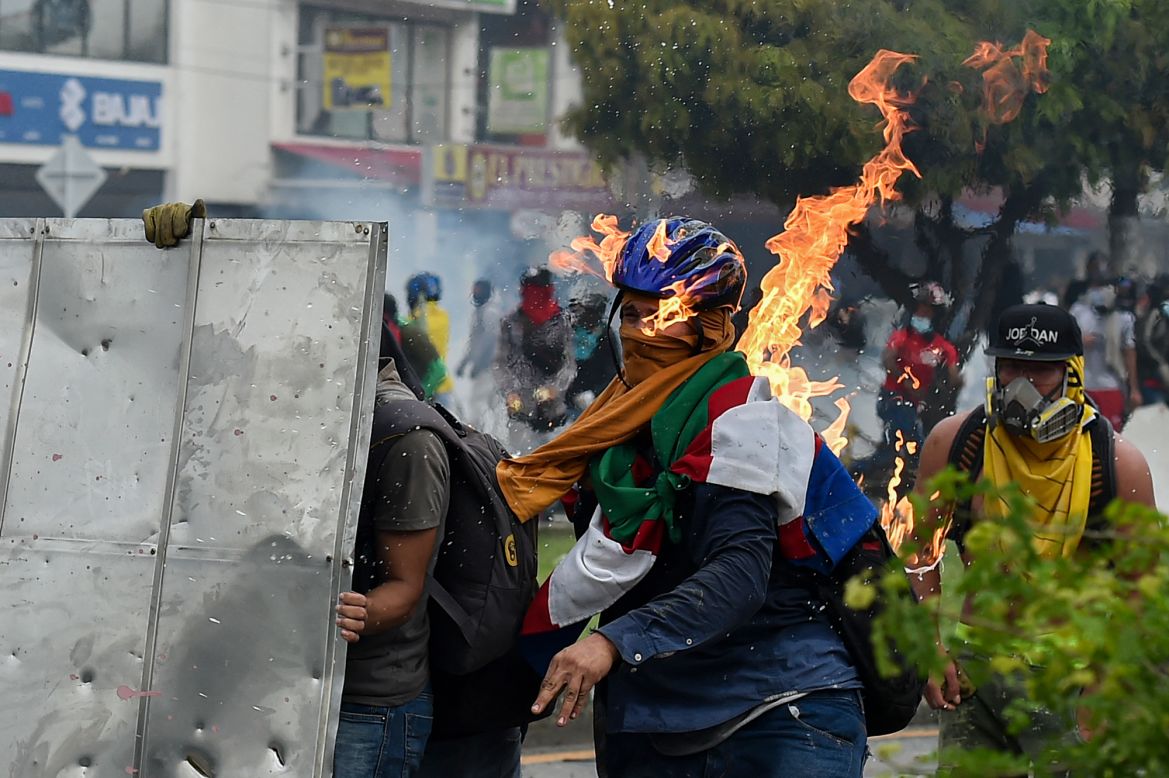 A protester is hit by a Molotov cocktail that was thrown during clashes with police in Cali, Colombia, on Monday, May 3. <a href="https://www.cnn.com/2021/05/06/americas/colombia-protests-explainer-intl-latam/index.html" target="_blank">Violent protests across Colombia,</a> fueled by economic frustration and exacerbated by a heavy-handed police response, have seen at least 25 people killed and hundreds injured.