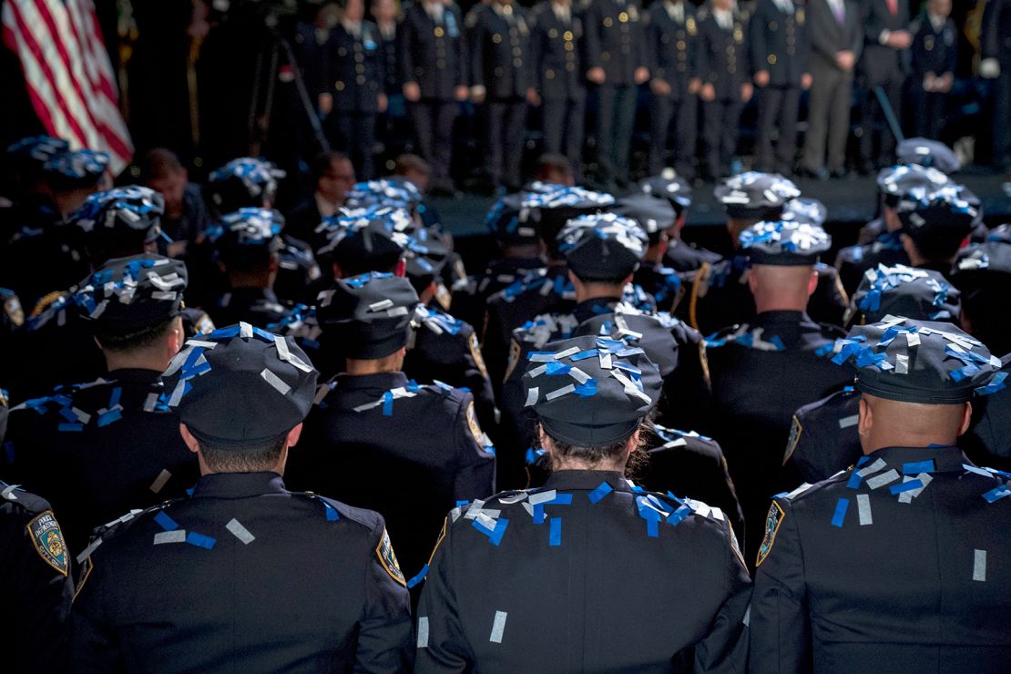 Confetti falls on the newest members of the New York City Police Department (NYPD) at the conclusion of their police academy graduation ceremony at the Theater at Madison Square Garden, October 15, 2018, in New York City.