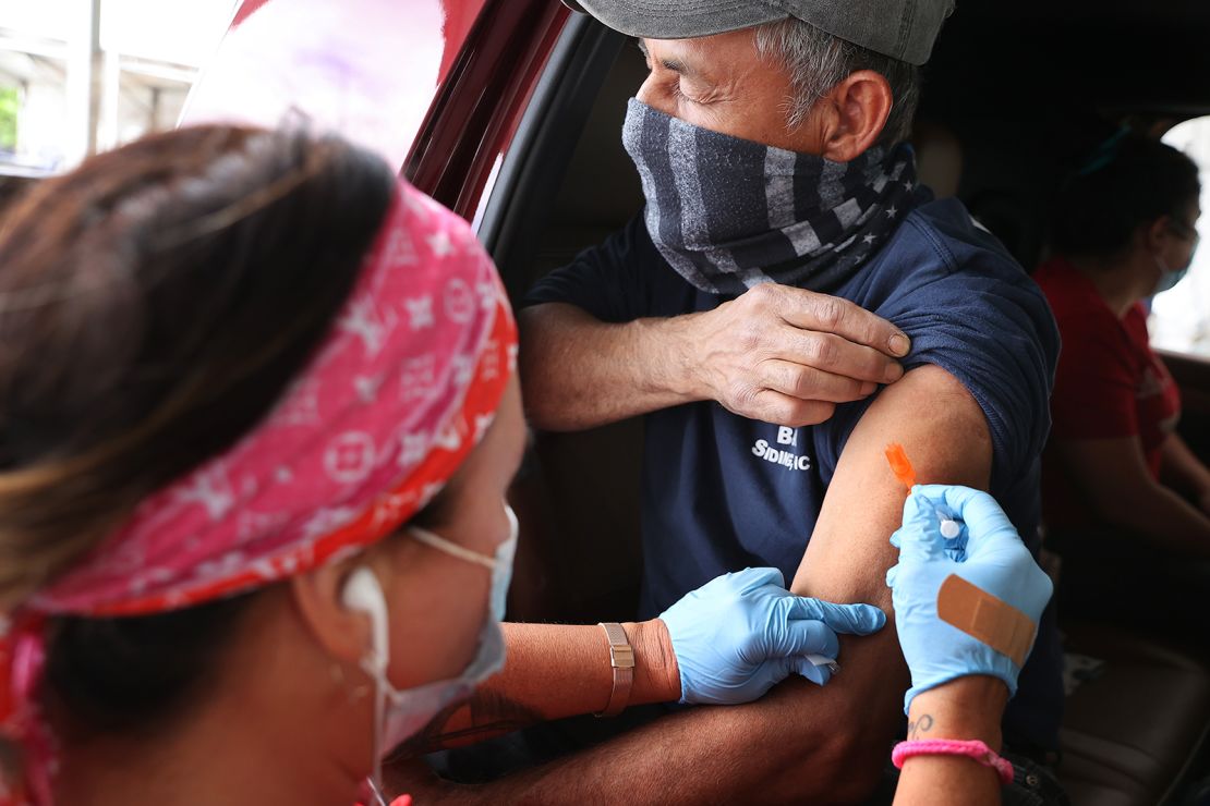 A man receives his first dose of the Pfizer vaccine in Maryland.