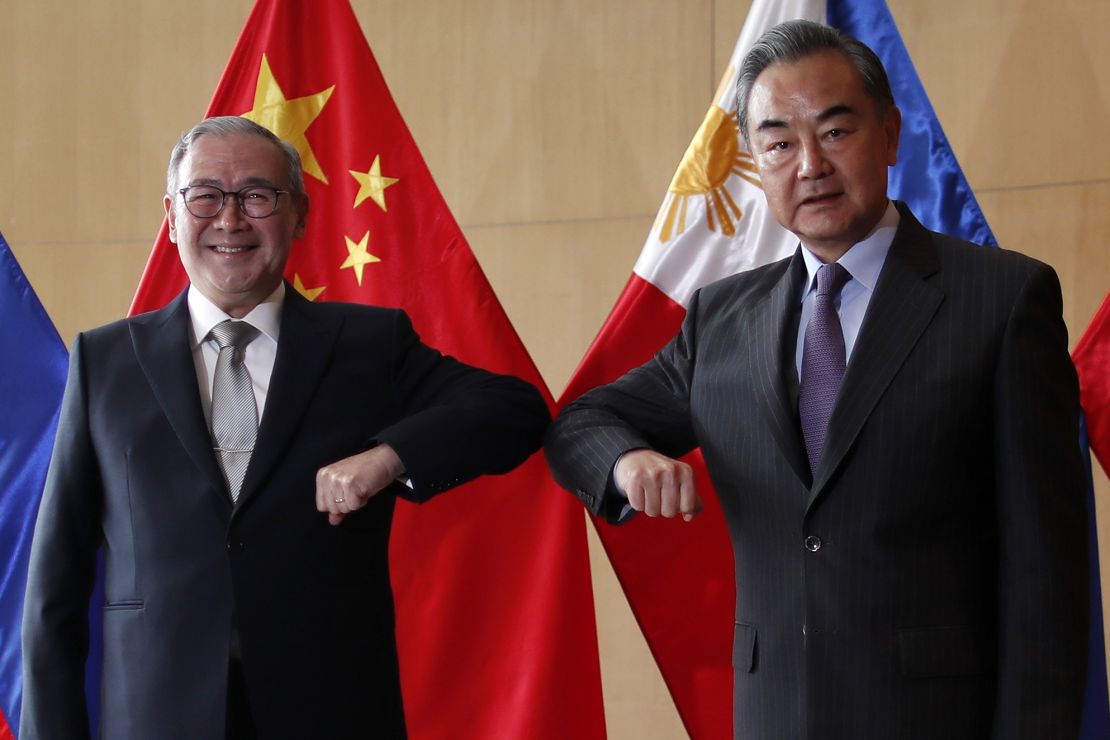 Philippine Foreign Affairs secretary Teodoro Locsin and Chinese Foreign Minister Wang Yi attend a meeting in Manila on January 16, 2021.