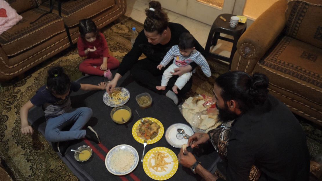 Khadija and her family gather for the nightly Iftar, composed nearly entirely of her neighbor's leftovers.