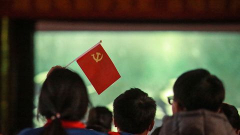 Children watch a propaganda movie "The Founding of a Party" in Yangzhou, in China's eastern Jiangsu province. Who needs Hollywood?