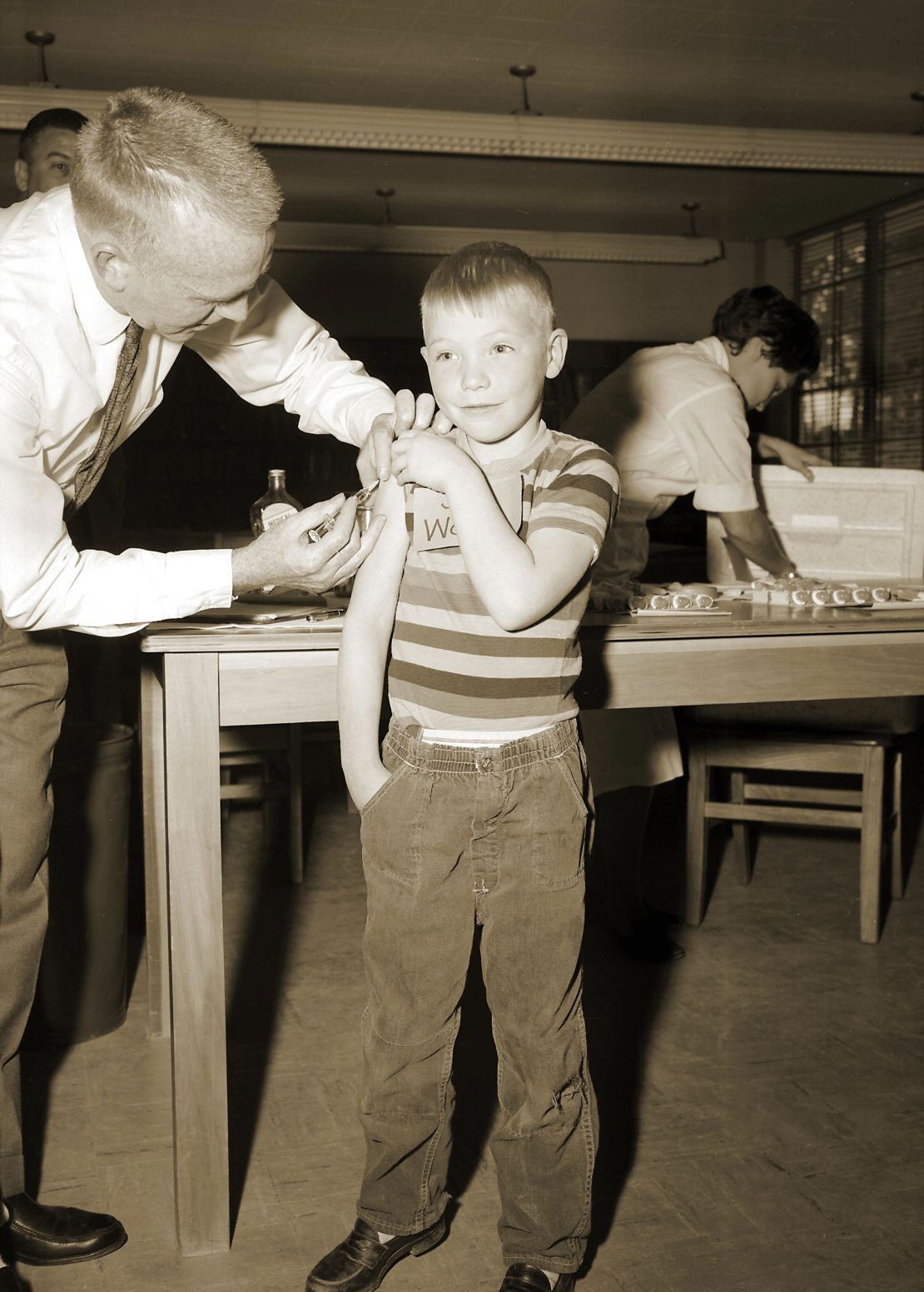 A doctor gives a measles vaccination to a boy in 1962 at Fernbank School in Atlanta.