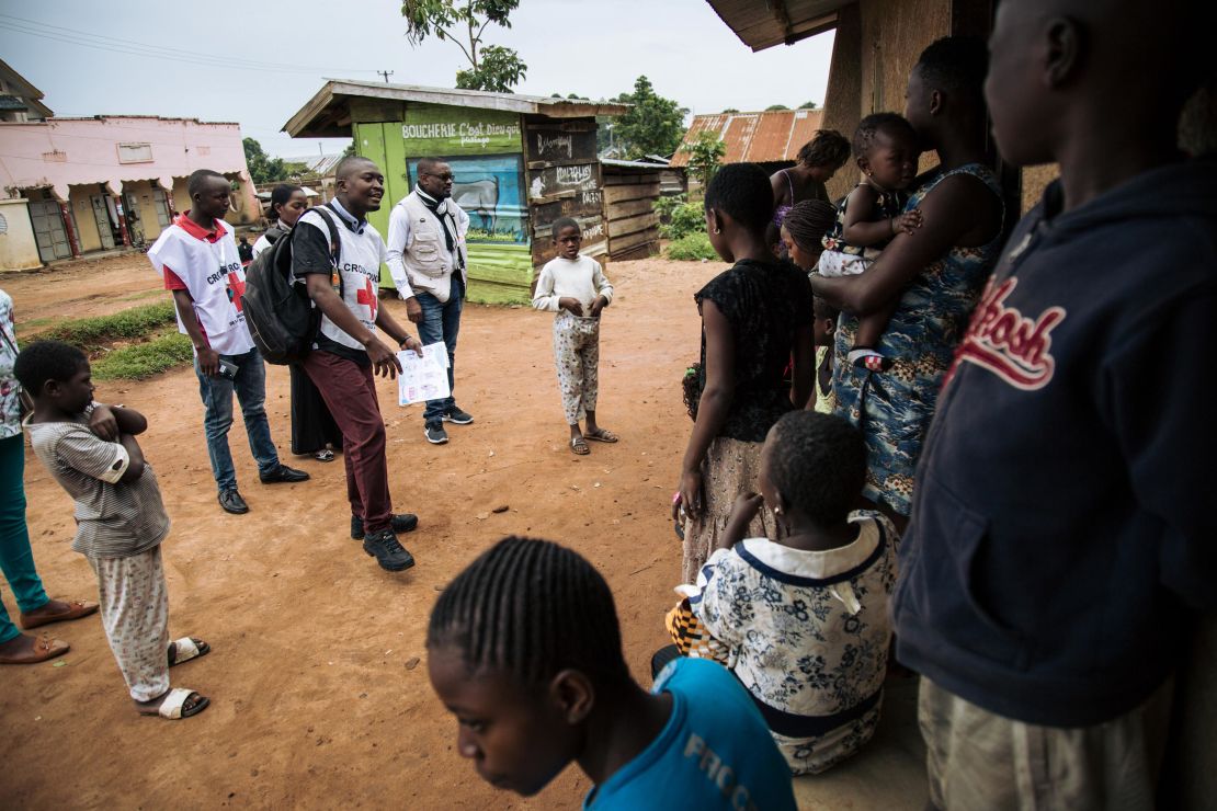 Red Cross officials in northeastern Democratic Republic of Congo meet with families in August 2019 to discuss fears surrounding Ebola and response teams. 