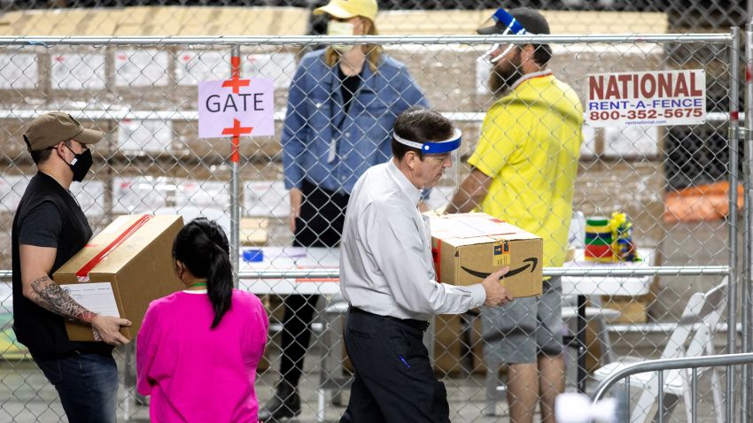 PHOENIX, AZ - MAY 01: Former Secretary of State Ken Bennett (right) works to move ballots from the 2020 general election at Veterans Memorial Coliseum on May 1, 2021 in Phoenix, Arizona. The Maricopa County ballot recount comes after two election audits found no evidence of widespread fraud in Arizona.  (Photo by Courtney Pedroza/Getty Images)
