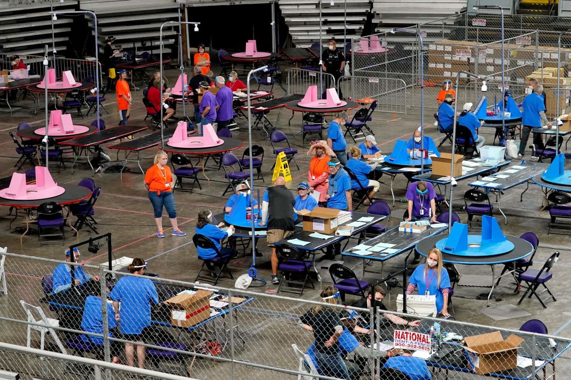 Maricopa County ballots cast in the 2020 general election are examined and recounted by contractors working for Florida-based Cyber Ninjas, on May 6, at Veterans Memorial Coliseum in Phoenix. (AP Photo/Matt York, Pool)