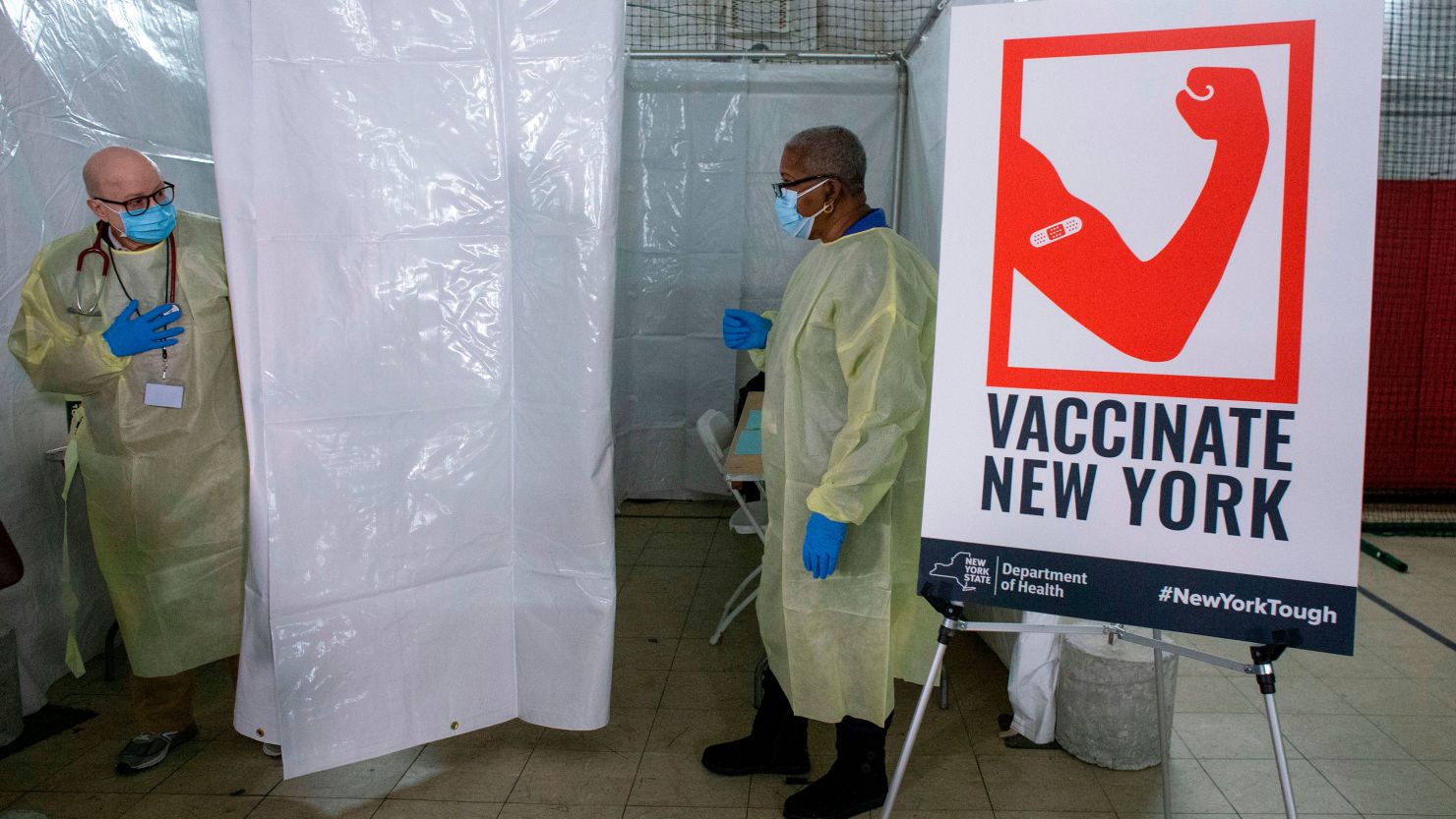 Health care workers wait for patients to administer Pfizer Covid-19 vaccines at the opening of a new vaccination site at Corsi Houses in Harlem in New York City on January 15, 2021.